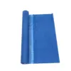 Blue rolled fabric with a textured surface, partially unrolled to display its full width against a white background.