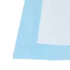 Close-up of a white absorbent pad with a pale blue border and a textured, diamond-patterned inner layer.