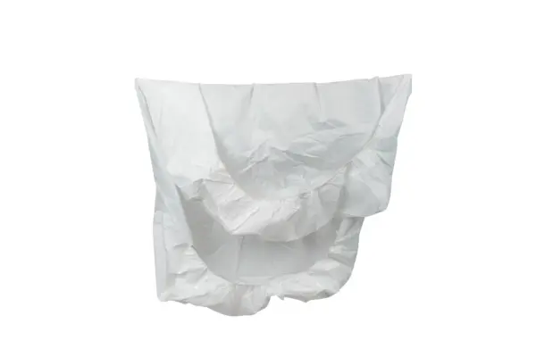 Crumpled white nonwoven protective cover with elasticated edges, isolated against a plain white background