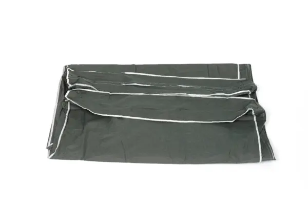 Folded dark green fabric cover with trim Folded dark green woven fabric cover with light gray edge trim, arranged flat against a plain white background.