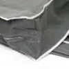 Close-up of gray mesh fabric and stitched seams Gray mesh fabric with white edging, reinforced stitching, and a folded seam detail on a plain surface