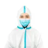 Healthcare worker in protective suit and face mask Healthcare worker wearing a white hooded protective coverall with blue seams and a blue surgical mask against white background.