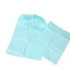 Light blue disposable plastic rain poncho with a drawstring hood, laid flat beside a folded matching section.