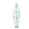 Medical worker in protective suit and face mask Medical worker standing against a white background in a white protective coverall with blue seams, mask, hood, and shoe covers.
