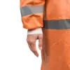 Close-up of orange high-visibility rainwear Close-up of a person wearing a wrinkled orange high-visibility waterproof jacket with wide gray reflective bands.