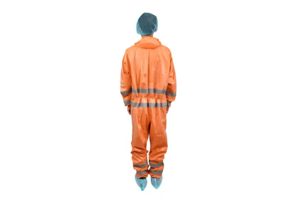 Back view of orange reflective protective coverall Person seen from behind wearing an orange protective coverall with reflective bands, blue hair cover, and shoe covers.