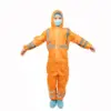 Worker wearing an orange protective coverall Person in an orange hooded protective coverall with reflective stripes, face mask, hairnet, and blue shoe covers