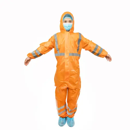 Worker wearing an orange protective coverall Person in an orange hooded protective coverall with reflective stripes, face mask, hairnet, and blue shoe covers