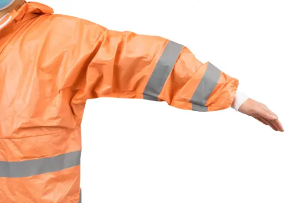 Orange reflective jacket sleeve on white background Cropped person wearing an orange high-visibility jacket with gray reflective bands and an extended arm