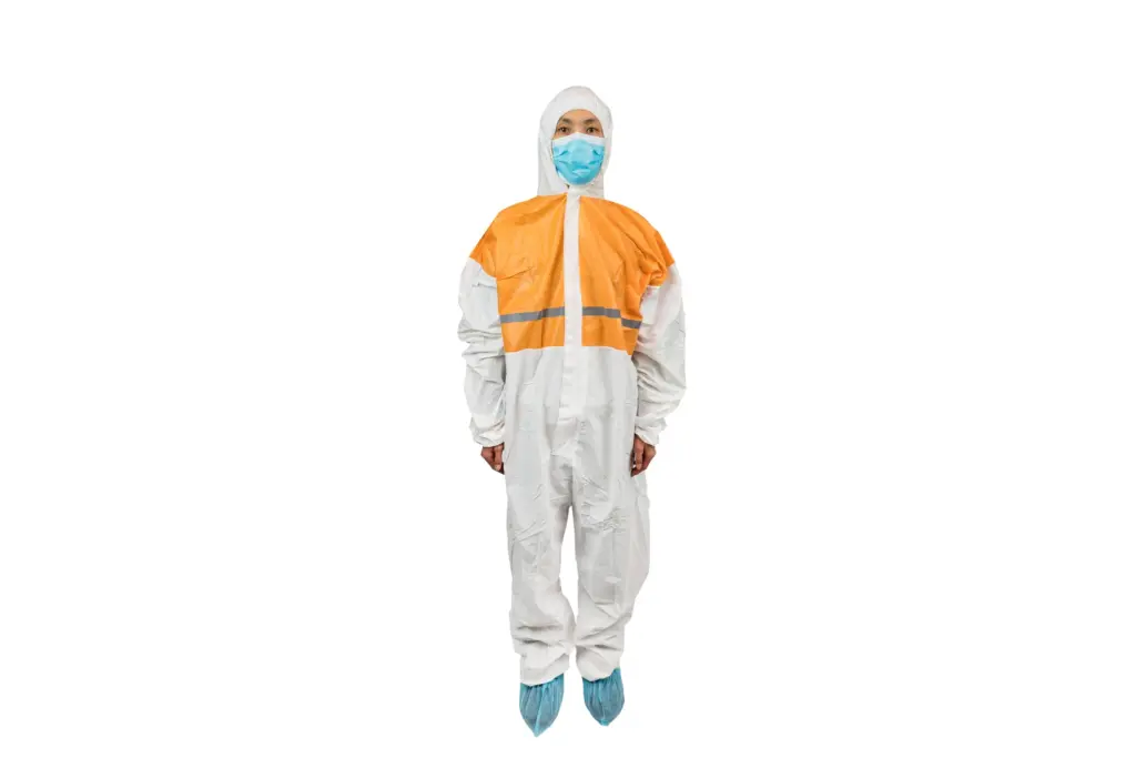Person wearing an orange and white protective coverall, face mask, hood, and blue shoe covers against a white background.