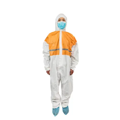 Worker in an orange and white protective coverall Person wearing an orange and white protective coverall, face mask, hood, and blue shoe covers against a white background.