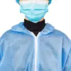 Person wearing a blue protective gown and face mask Close-up of a person wearing a blue disposable protective gown, surgical face mask, hair cover, and black turtleneck.