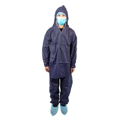 Front view of person in navy protective coveralls Person standing in navy hooded protective coveralls, blue face mask, hair cover, and disposable shoe covers on white background.
