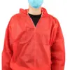 Person wearing a red protective gown and mask Person shown from the shoulders down wearing a red hooded protective gown over black clothing and a blue surgical mask