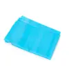 Stacked blue disposable face masks on white Several blue pleated disposable face masks are stacked at an angle against a clean white background