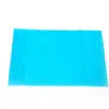 Turquoise fabric panel displayed on a white background Bright turquoise rectangular fabric panel with stitched edges, laid flat against a plain white background.