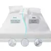 White mattress protector showing a soft, breathable skin-friendly front and a waterproof TPU-backed surface with water droplets.