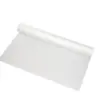 A large roll of thin white plastic sheeting partially unrolled across a clean white background, showing its smooth surface.
