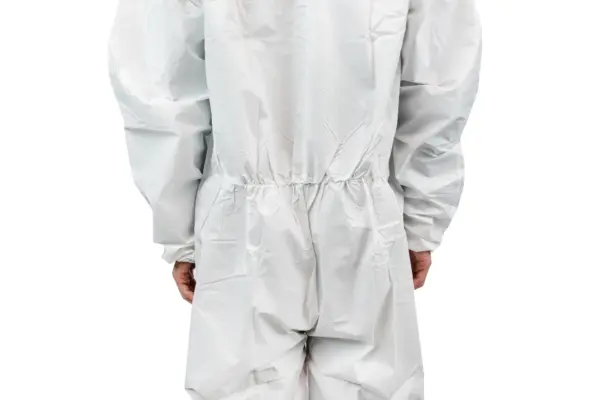 Back view of a white protective coverall Person seen from behind wearing a loose white protective coverall with an elastic waist and gathered sleeves