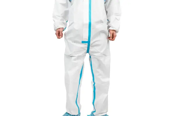 White protective coverall with blue sealed seams Person standing against a white background wearing a white full-body protective coverall with bright blue taped seams.