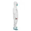 White protective coverall with mask and shoe covers Person in a white hooded protective coverall wears a blue surgical mask and disposable shoe covers against a white background.