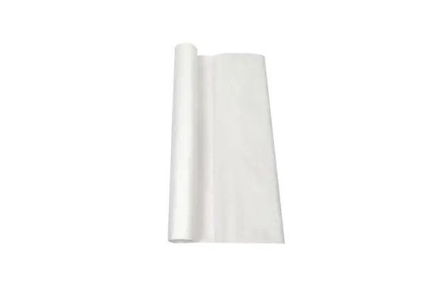 White sheet of paper partially unrolled from a narrow roll against a plain white background