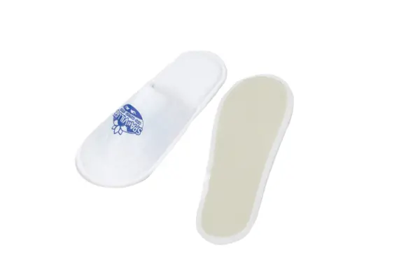 Pair of white open-back slip-on slippers, with one showing a blue printed design and the other revealing its sole.