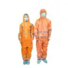 Two workers in orange protective suits and masks Two people wear orange hooded protective suits, face masks, hair covers, reflective bands, and blue shoe covers on white.