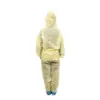 Back view of yellow protective coverall Person standing with their back to the camera in a yellow hooded protective coverall and blue shoe covers on white.