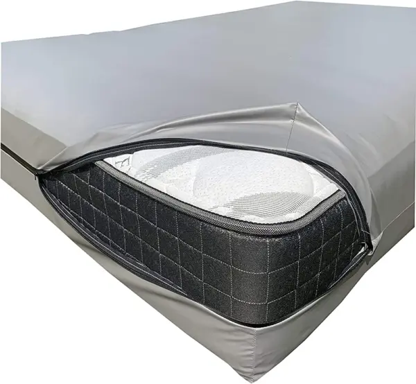 A silver zippered mattress cover is partially open, revealing a white mattress inside its protective storage enclosure.